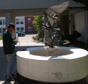 Scott Kendall with the Annis Water Resources Intistute test water from the fountain at the Alpena County public library.  Photo: Scott Kendall