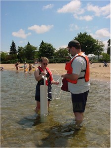 United States Geologic Survey scientists sample for bacteria in ground water at Clinch Beach in Traverse City, Mich. Photo courtesy of the U.S. Environmental Protection Agency. 