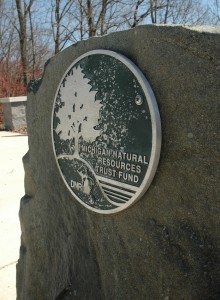 A plaque dedicated to the Michigan Natural Resources Trust Fund stands at Greenview Point Park in Lyons, MI. The park received a $144,700 grant for improvements in 2005. Photo: Becky McKendry.