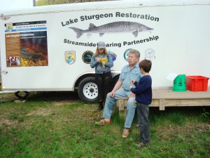 Kalamazoo Sturgeon for Tomorrow member Ron Clark and family help supervise activities at portable streamside rearing facility. Photo: Talli Nauman
