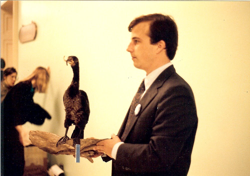 GLU Executive Director David Miller holding the taxidermied cormorant (Henrietta) with a crossed bill during Great Lakes Washington Week 1988. 