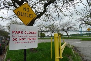 Riverside Park in Detroit. Despite the sign, cars were lined up and the park was full of people fishing on a weekend in mid-May. Photo: Lewis Wallace.