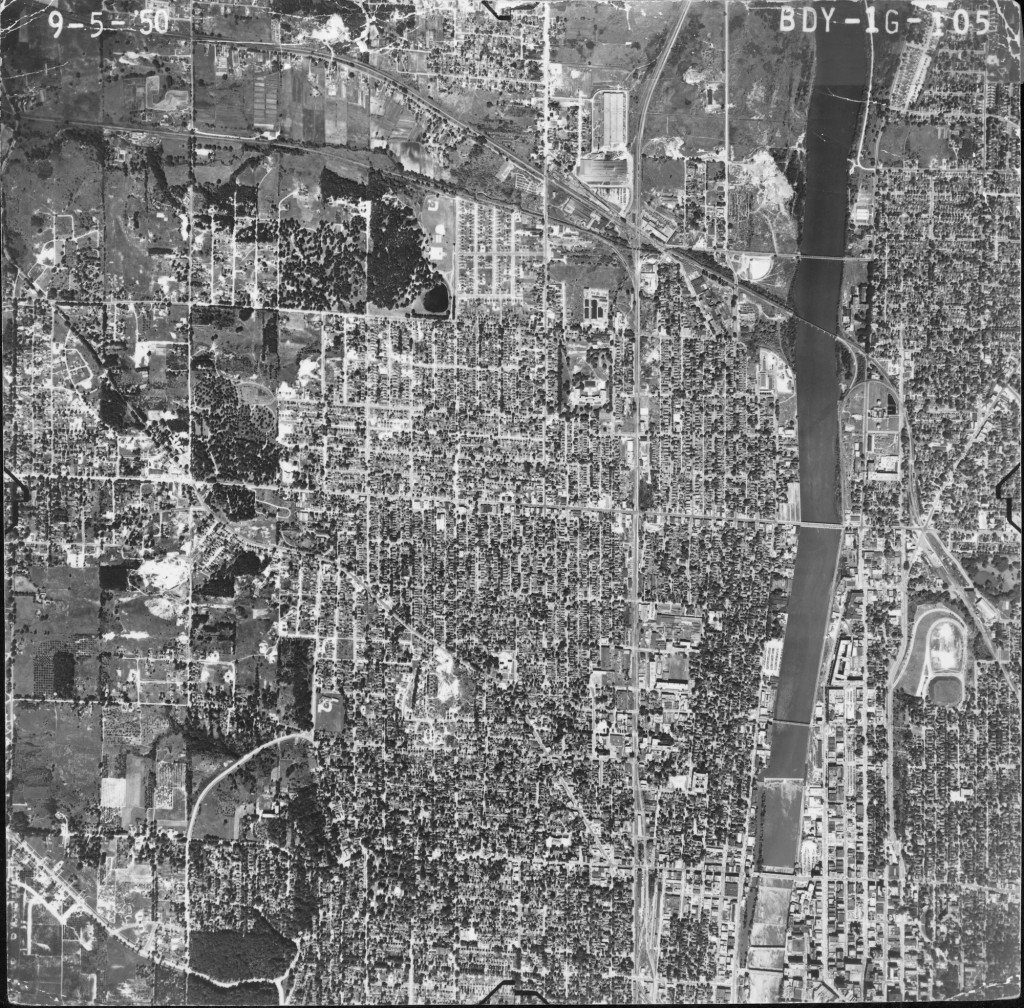 In 1950 the Grand River separated downtown Grand Rapids into two section. There are only houses, not businesses, along the river.