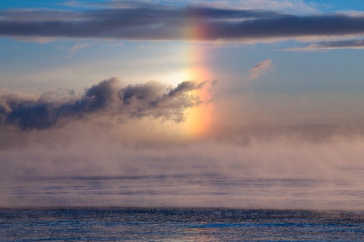 This image shows what is called a "sundog," a naturally occurring reflection of light on the edge of a halo around that sun that is produced by fog in cold temperatures above water. (Image: Shawn Malone, Earth Science Picture of the Day)