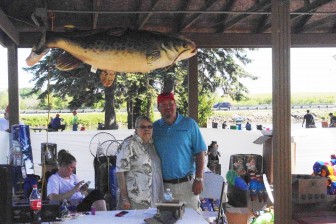 Adam Musselman with Sheran Sholtz, wife of the late Joe Sholtz who founded the derby more than 15 years ago. Musselman helped organize this year's  event and gather prizes donated by Gratiot County merchants. Image: John Evans of the Gratiot County Herald