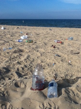 Lake Michigan beach at Grand Haven State Park is left covered in garbage after the Fourth of July. Image: Jamie Cross