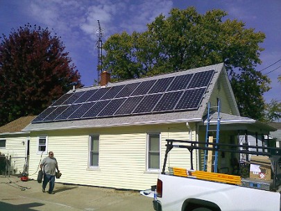 Workers for Michigan Solar Solutions complete an installation in Flint; owner Mark Hagerty says the panels doubled the value of the home. Image:  Michigan Solar Solutions