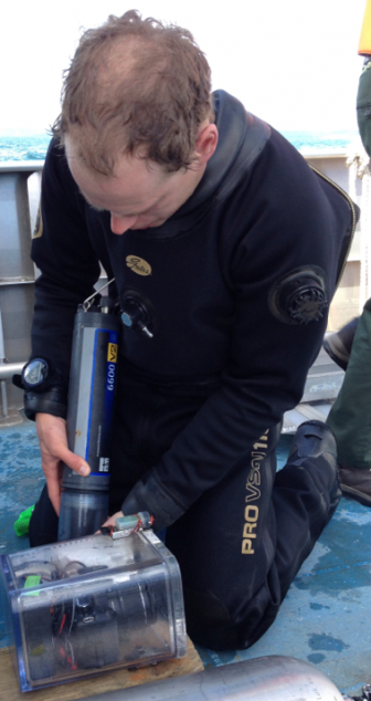 Graduate student Ben Turschak transfers water samples. Image: Brian Bienkowski