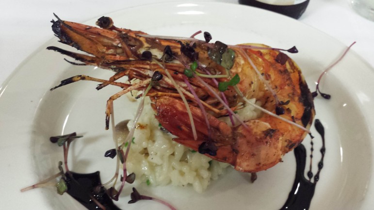 Char-broiled tiger prawn with wild mushroom risotto and truffle essence. Image: David Poulson