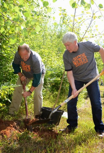 DNR Director Keith Creagh and Gov. Rick  Snyder assisted volunteers in planting more than 75 fruit-trees and shrubs to  enhance a new hunter walking trail in  southern Marquette County Aug. 13. Image: Michigan Department of Natural Resources