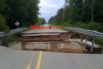 A flood-damaged road near Ludington, Michigan in 2008. Extreme weather events resulting from climate change are expected to take a heavy toll on infrastructure in the future.  Image: Josh Bis via Creative Commons