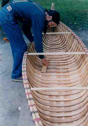 Curved ribs made of white cedar are added the full length of the canoe to provide support and shape.  Photo: Courtesy Eric Mase