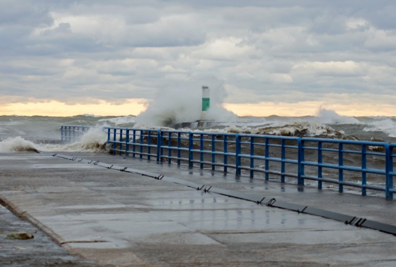 Waves wash over the South Haven, Michigan piers on a stormy November afternoon.