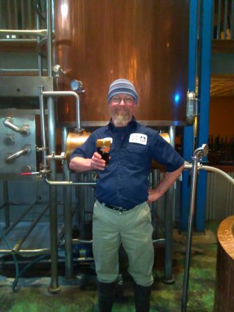 New Holland Brewing Co. Head Pub Brewer Steve Berthel holds a glass of his Macatawa Stout, made from 100 percent Michigan ingredients. Image: Hannah Nyboe