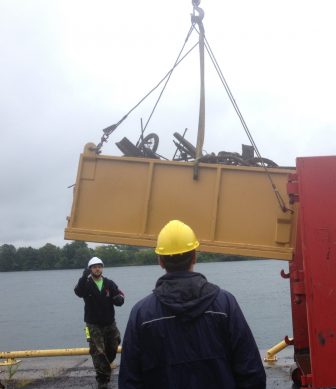 The river cleanup in Cornwall used mobile cranes to pull debris out of the water. Image: Karen Cooper