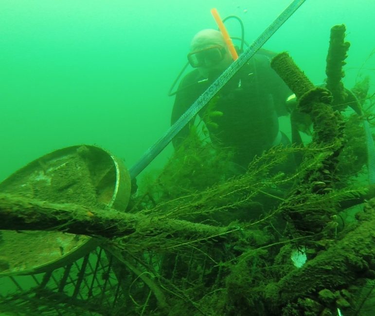 A diver removes garbage that could have been fish habitat. Image: Karen Cooper