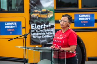 Moms Clean Air Force demonstrates an electric school bus in front of a manufacturing facility as a part of its national Let’s Get Rolling Tour in 202. Courtesy photo