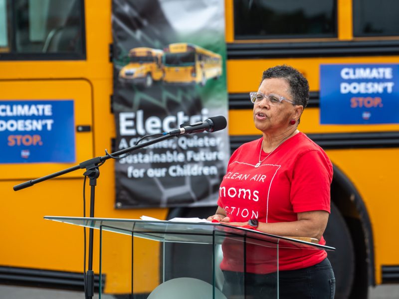 Moms Clean Air Force demonstrates an electric school bus in front of a manufacturing facility as a part of its national Let’s Get Rolling Tour in 202. Courtesy photo