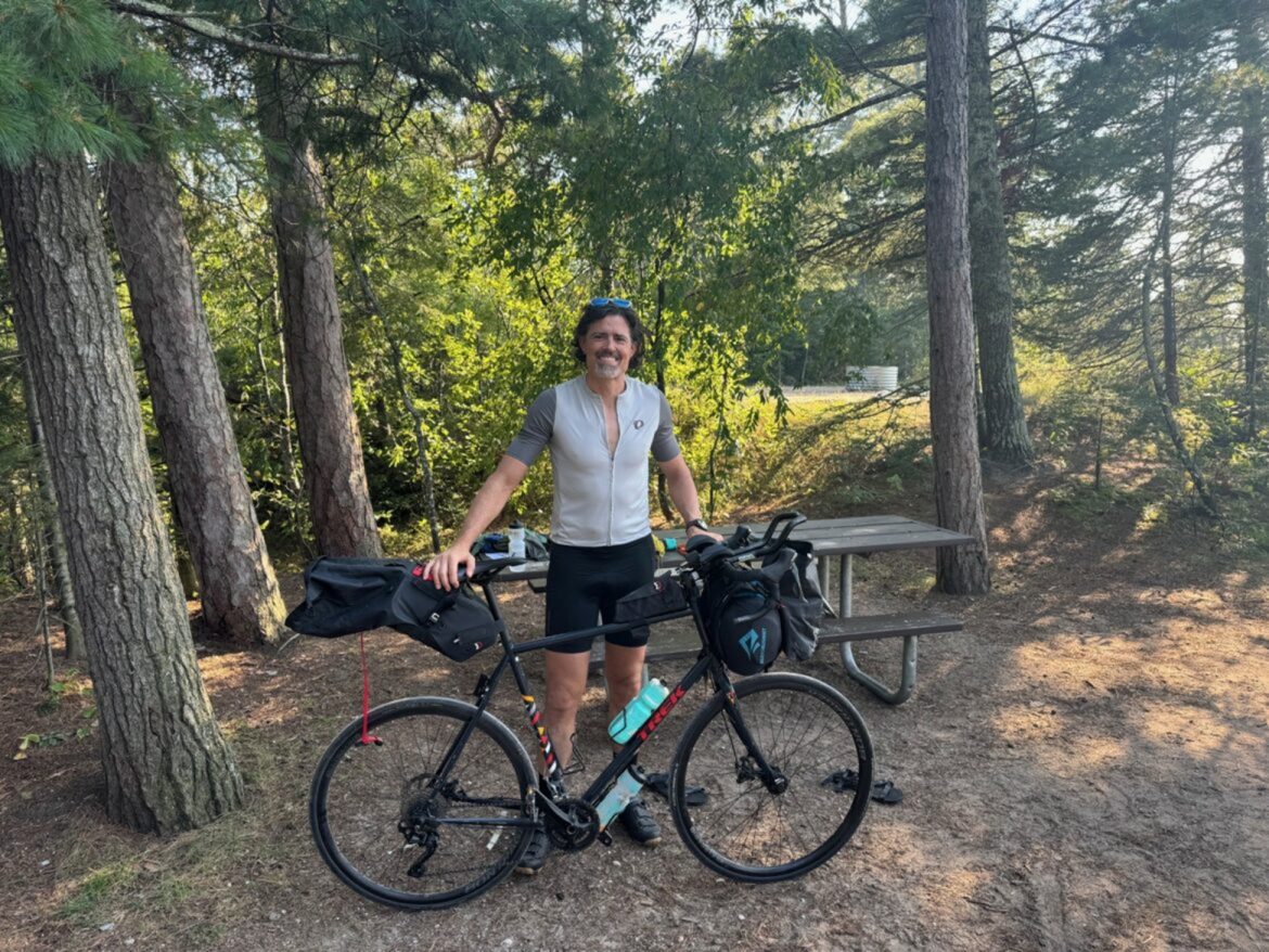 Lamont Black poses for a photo with his bike.