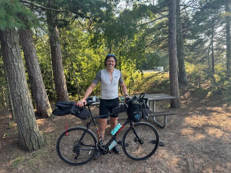 Lamont Black poses for a photo with his bike.