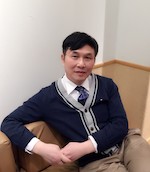 Photo of Chen sitting in a chair