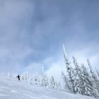 People skiing on a snow-covered slope.