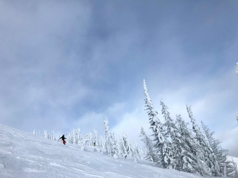 People skiing on a snow-covered slope.