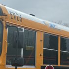 The side of a yellow school bus.