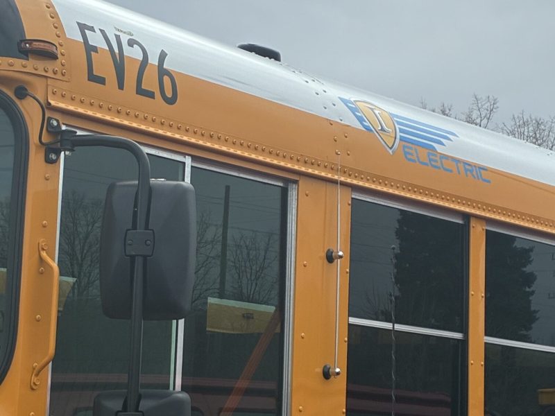 The side of a yellow school bus.