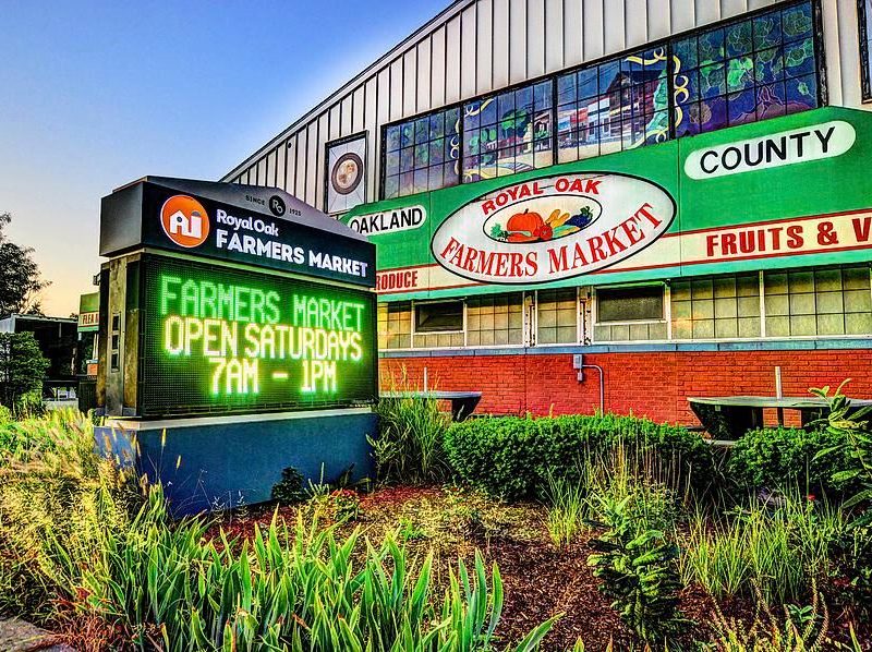 The Royal Oak Farmers Market sign and building.